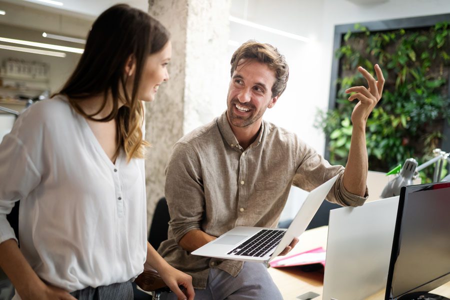 Technology Firm Insurance - Technology Company with Co Workers Chatting